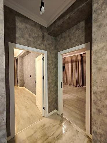 gence bina evleri: Mənzilin təsviri - Geniş və işıqlı zal: divaraquraşdırma TV stendi — 9