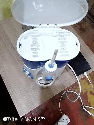 Stasionar ağız duşu (irrigator) - Su çəni: iri həcimli, mavi şəffaf