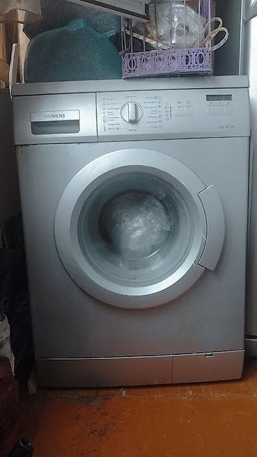 klas 6: Siemens paltaryuyan maşın, ön yükləməli model. Korpus gümüşü rəngdədir — 1