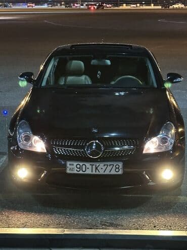 panarama ce kılas: Mercedes‑Benz CLS — qara kuzov, dörd qapılı kupe dizaynı. Ön hissədə — 1