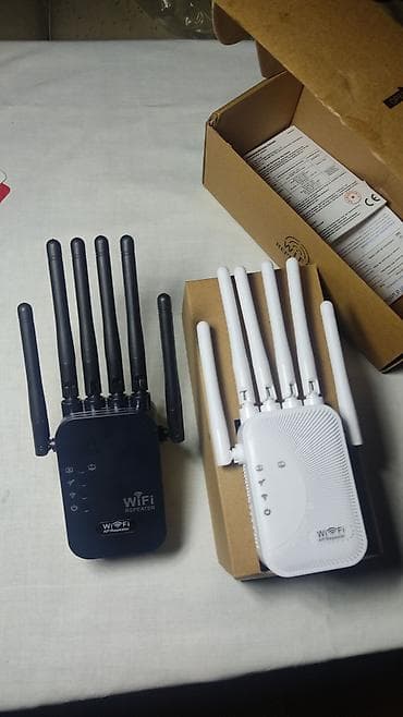 Modemlər və şəbəkə avadanlıqları: WiFi Siqnal Gücləndirici / AP Repeater - Rənglər: qara və ağ - — 1