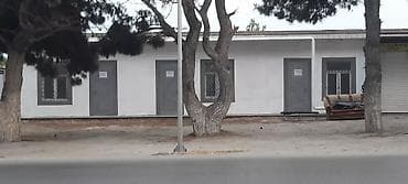 - Magistral yolun birbaşa kənarında yerləşən təkmərtəbəli tikili -