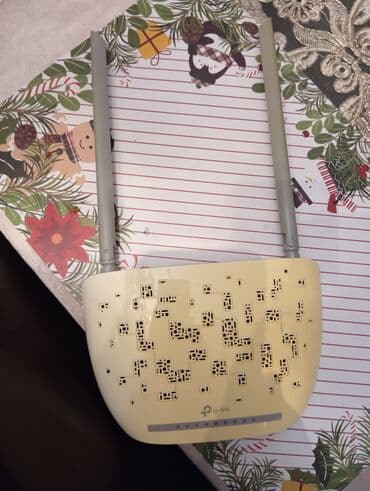 ruter modem: TP-Link şirkətinin istehsalı olan, iki antenli ağ ruter. Evdə və ya — 5