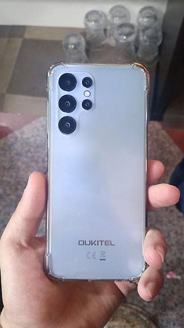 9990 telefon: Oukitel smartfon - Marka/model: Oukitel (arka qapaqda loqo) - Rəng — 3
