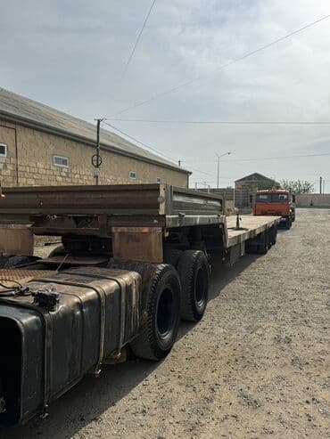lapeti: Yaşıllaşdırılmış rəngdə, uzun platformalı, çox oxlu qoşqu. Ağır — 2