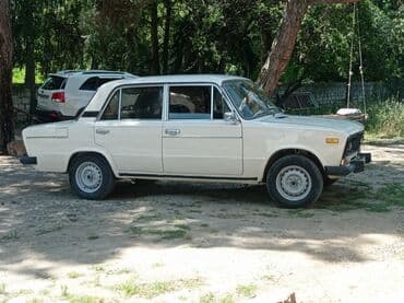 ваза напольная стеклянная высокая без узора: Model: VAZ 2106 sedan Xüsusiyyətlər: - Rəng: ağ, 4 qapı - Mexaniki — 10