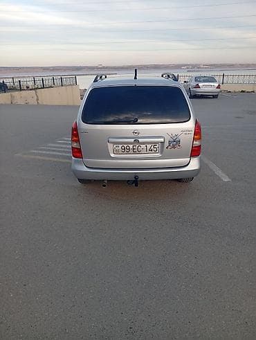 yuk baqajı: Opel Astra Caravan (universal) – gümüş rəng • Kuzov: universal (5 — 3