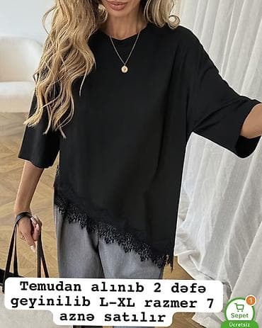 Şəxsi əşyalar: Qara rəngli qadın bluzası. Oversize kəsim, yarımqol dizayn. Aşağı — 1