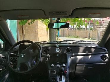 e39 radiator: Mitsubishi (Airtrek/Outlander ilk nəsil) krossover, ağ rəng. Xarici — 10