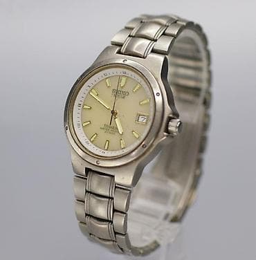 qolba: Seiko Solar Titan saat - Model: Seiko Solar, kalibr 5K25 (arka — 1