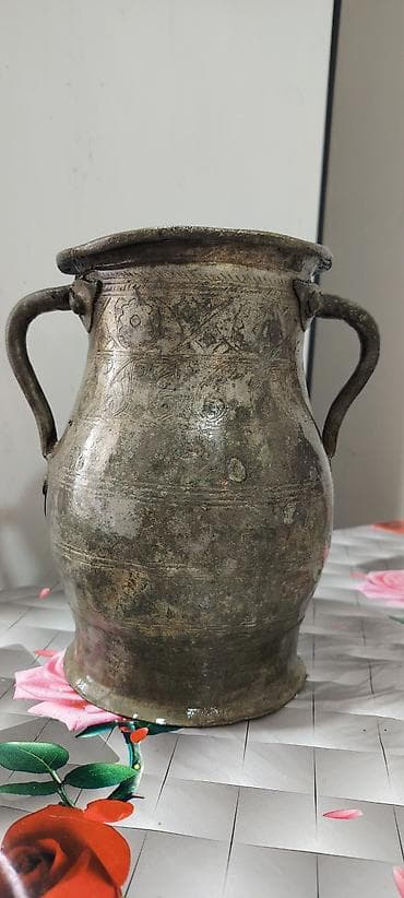 1dollar nece manatdir: L: Mis sərnic (iki qulplu qədim su qabı) torpaq altindan tapilib — 2