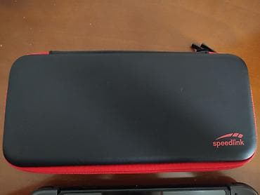 Xbox Series S: Nintendo Switch oyun konsolu – boz Joy-Con nəzarətçiləri ilə.Bircə sol — 3