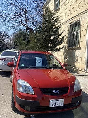 uaz satilir: Kia Rio hatchback (qırmızı rəng), 5 qapı, AZ dövlət nömrə nişanı — 1