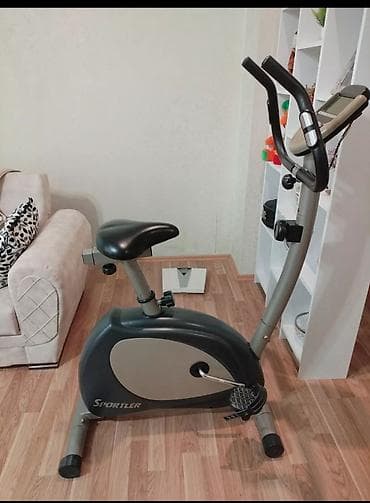 Sportler firmasının qara və boz rəngli velotrenajoru. Evdə idman etmək