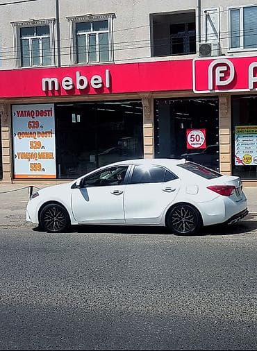 byd disk teker: Toyota Corolla, ağ rəng,sedan gövdə. I - Nömrə nişanı: 99-KY-573 — 6