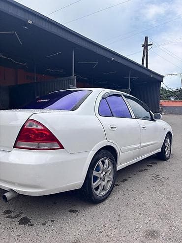 klas 6: Nissan Sunny: 1.6 l | 2007 il Sedan — 3