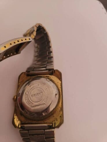 el fecr saat: İşlənmiş, Qol saatı, Orient, rəng - Qızılı — 3