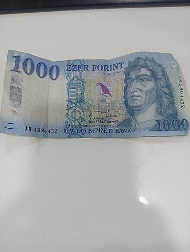 gitara simi: Macaristanın rəsmi pul vahidi olan 1000 forint əsginası — 1