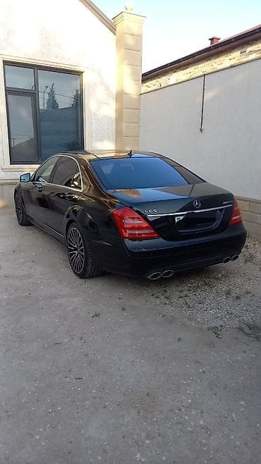 mercedes benz cl class: Mercedes‑Benz S-Class sedan (W221), qara rəng, V12 emblemli. Xarici — 6