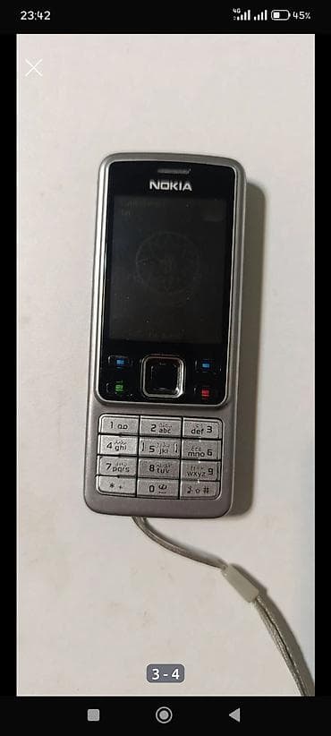 iran peçi şam: Nokia 6300 4G, rəng - Gümüşü, Düyməli — 2