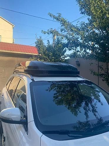 eşşək arabası: Avtomobil üçün dam üstü baqaj qutusu (roof box). Aerodinamik formalı — 6