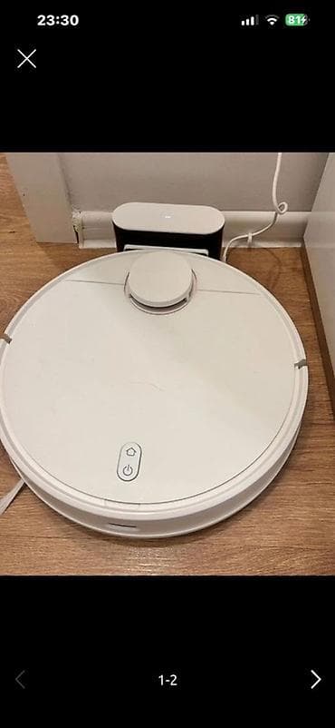 Robot tozsoran və aksesuarları - Ağ rəngli dairəvi robot tozsoran — 2