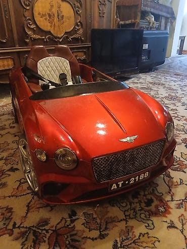 oyuncaq kamaz type 1: Uşaq üçün elektrikli minik maşını – kupe tipli, qırmızı metalik rəng — 1