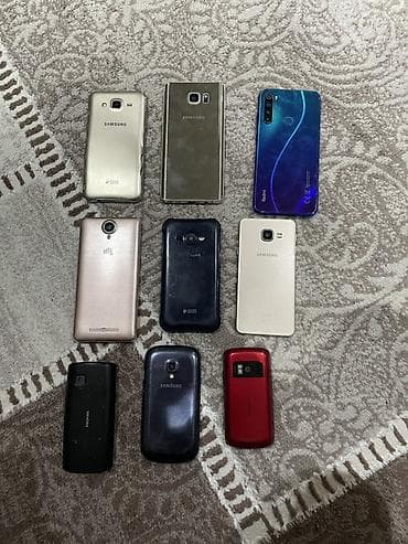 9 ədəd telefon bəziləri tam işləkdir bəziləri zapçast kimi istifadə