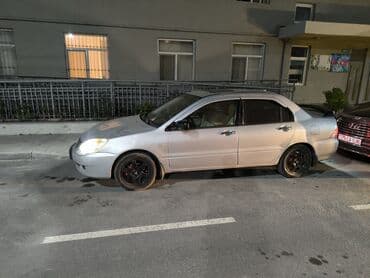 e 124: Mitsubishi Lancer: 1.6 l | 2006 il 34000 km Sedan — 6