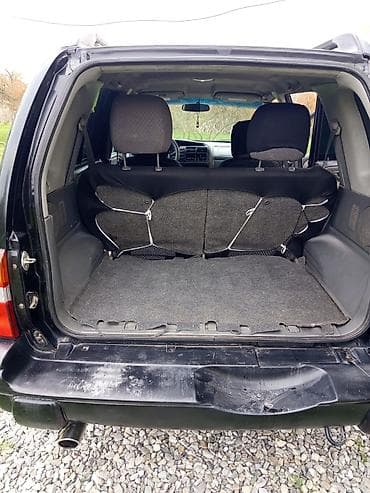 === PART 1: TEXTUAL DESCRIPTION === Qara rəngdə Chevrolet Tracker SUV