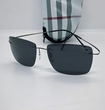 qadın eynəkləri ucun futlyar: Qara rəngli çərçivəsiz dizayna malik unisex günəş eynəyi. Düzbucaqlı — 1