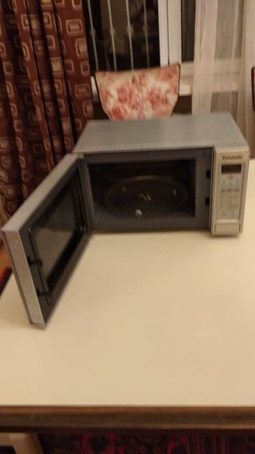 Информатика: Микроволновка Panasonic, Отдельностоящая, С микроволнами, цвет - Серый, Новый — 1