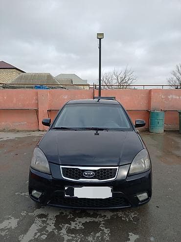 opel astra universal: Kia Rio – hetçbek, qara rəng Xüsusiyyətlər: - Kuzov: 5 qapılı — 8