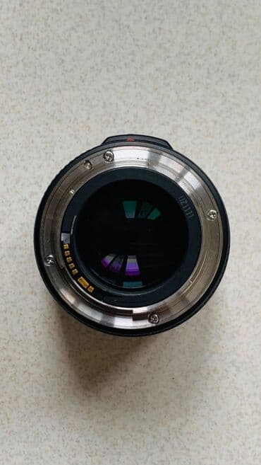 printer satisi islenmis: Canon EF 35mm f/1.4 L USM
Tam ishlek veziyetde, ciziqlari var — 8