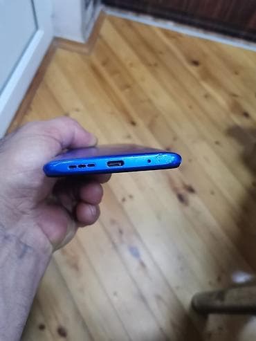 herbi telefon: Mavi rəngli smartfon - Ekran: ön hissədə damla tipli ön kamera kəsiyi — 3