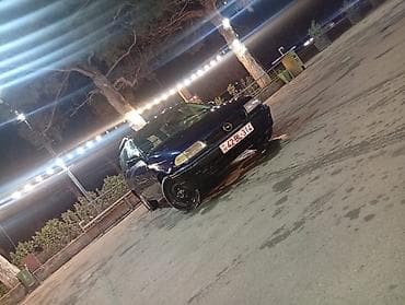 2107 oturacaq: Opel Astra: 1.6 l | 1995 il Universal — 1