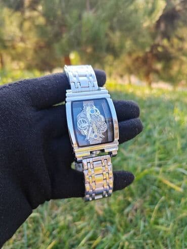 Mega Endirimdə. Hər iki tərəfi şüşə olan kişi qol saatı. Batareyka