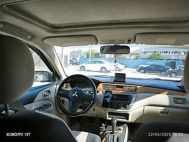 cəliloğlu avto: Mitsubishi Lancer sedan – gümüşü rəng, qara disklər. Nömrə: 77-NE-396 — 2