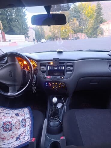 авто подлокотники: Kia Rio: 1.4 л | 2008 г. Седан — 3