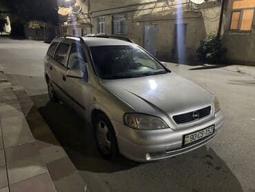 чемодан с инструментами для автомобиля: Opel Astra Caravan (universaI) – gümüşü rəngdə, 5 qapılı ailə və yük — 4