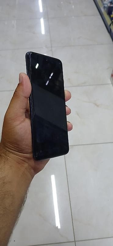ucuz macbook: Xiaomi Redmi smartfon - Model: Redmi (arka qapaqda “Redmi” loqosu) — 4