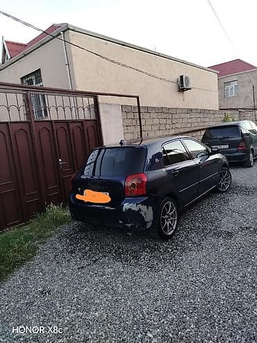 vito disk: Toyota Corolla hatchback (E12), tünd mavi rəng. - Kuzov: 5 qapılı — 4
