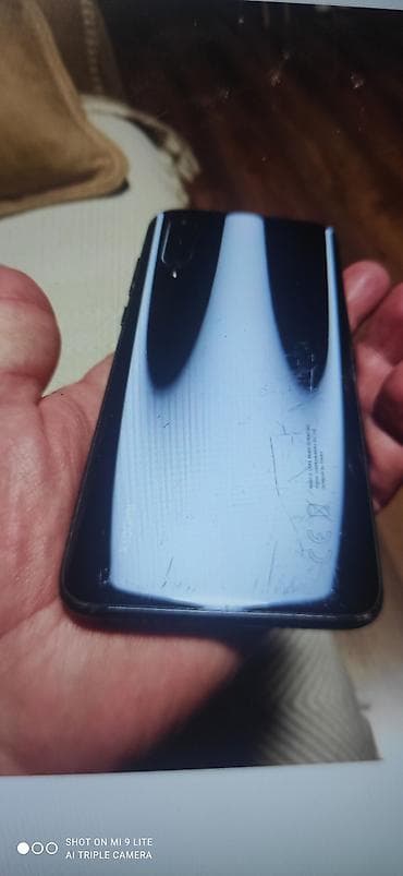 islemis telefonlarin satisi: Xiaomi Mi 9 Lite, rəng - Qara, 
 Barmaq izi — 2