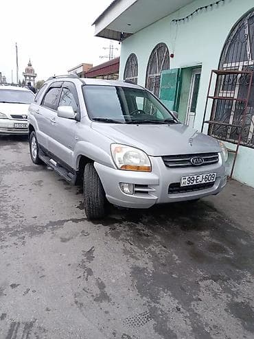 volkswagen tiguan ii: Kia Sportage: 2 л | 2007 г. Универсал — 1