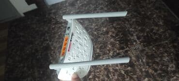 el modemi: TP-Link Wi‑Fi router - Model: TP-Link (üzərində LED indikator paneli — 2