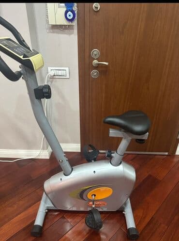protein satışı: Stasionar velosiped – ev üçün fitnes trenajoru - Kompakt, sabit — 1