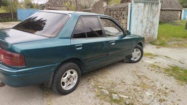 lider disk təkər: Mazda 323: 1.6 l | 1994 il Sedan — 4