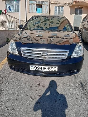 man sat: Nissan Teana – qara rəngli, geniş və komfortlu sedan. Xüsusiyyətlər — 1