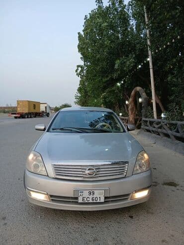 запчасти на фольксваген гольф 2: Gümüşü rəngli Nissan Teana avtomobili, dörd qapılı sedan modelidir — 7