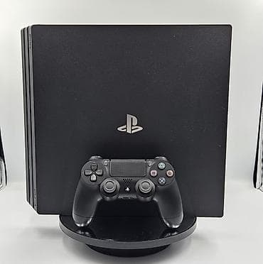 09.00 Praşifka model Sony PlayStation 4 Pro (PS4 Pro) oyun konsolu + 1